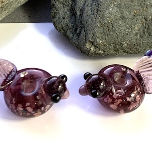 Transparent amethyst lampwork bird bead pair