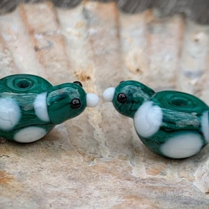 Green lampwork bird bead pair