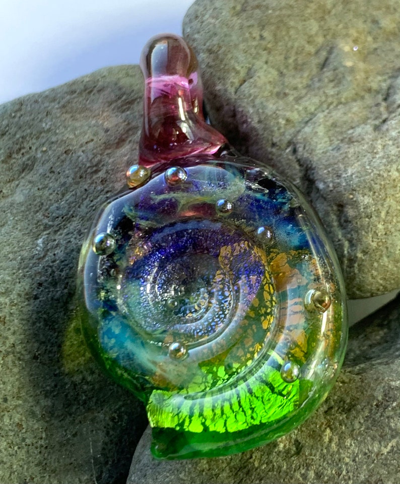 Large sparkling purple green and gold glass ammonite lampwork pendant