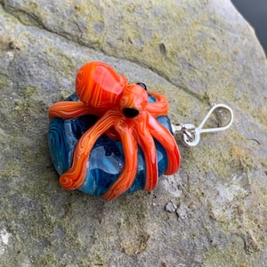Red octopus lampwork glass pendant with sterling silver bail