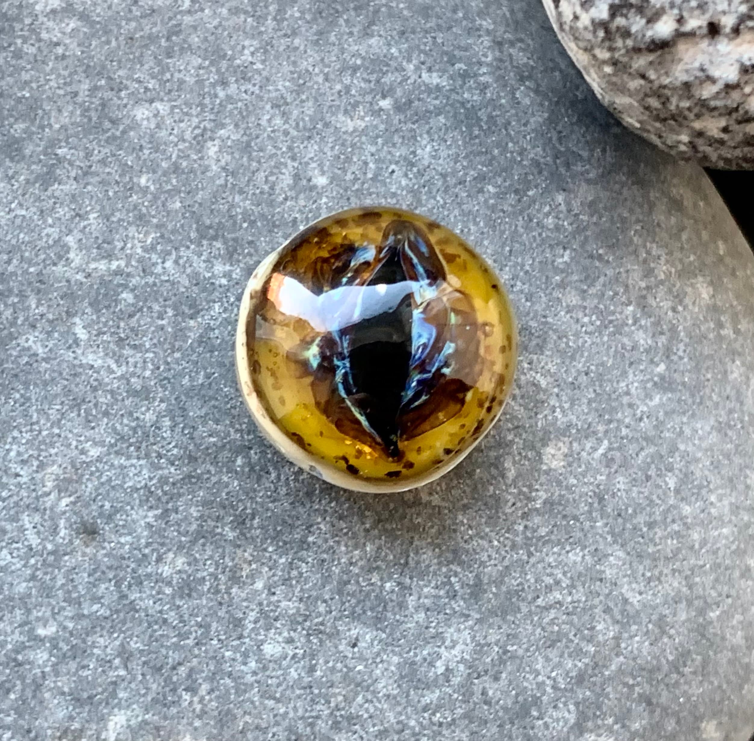 Glittery mottled amber lampwork glass dragon eye cabochon. Perfect for silversmithing, polymer clay or beading projects
