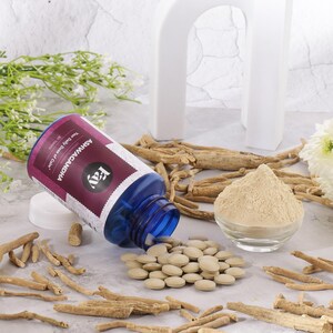 May include: A blue bottle of Ashwagandha tablets with a purple and white label, alongside a pile of tablets, a small bowl of powder, and dried roots. The label reads "Your Daily Dose of Calm."