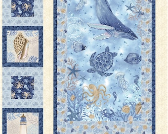 May include: A marine-themed quilt featuring a whale, sea turtle, and various sea creatures in shades of blue and beige. The design includes starfish, jellyfish, and seashells. The quilt has a central panel and framed squares with nautical motifs.