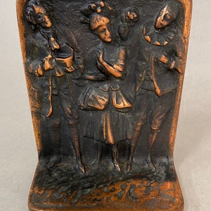 Pair of Cast Iron Bookends with Figures in Fancy Dress
