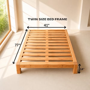 May include: A light brown wooden twin size bed frame with a slatted base. The frame features dimensions of 41 inches in width, 77 inches in length, and 14 inches in height, as indicated by the text and arrows overlaid on the image.