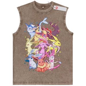 May include: A brown sleeveless shirt with a crew neckline featuring a graphic print of nine colorful fictional creatures. The design includes various characters in shades of blue, yellow, pink, and purple, accented by small stars. A white tag is attached.