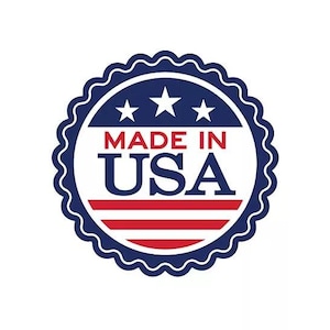 May include: A round emblem with a scalloped edge, featuring the text "MADE IN USA" in red and white, with three white stars above. The design incorporates red and white stripes, set against a white background, and a navy blue border.