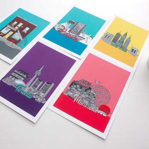 May include: Set of five illustrated city skyline postcards. Each postcard features a different city: Toronto, Montreal, Calgary, New York, and a red building with a sign that says "The Annex".