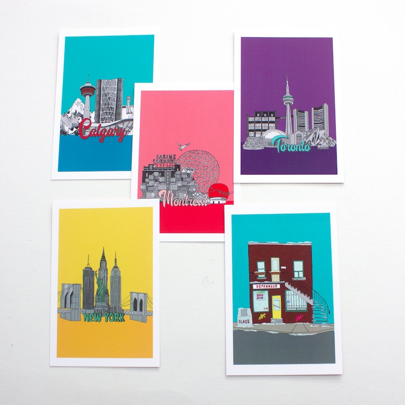 May include: Five postcards with illustrations of different cities. The postcards are turquoise, purple, pink, yellow, and turquoise. The cities featured are Calgary, Toronto, Montreal, New York, and a city with a red building.