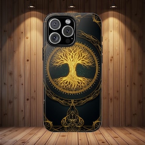 May include: Black smartphone case featuring a golden tree of life design. The tree is centered within a circular frame, with intricate golden details against a dark background. The case has a glossy finish and a camera module with multiple lenses.