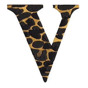 May include: Embroidered letter "V" in a leopard print design. The letter features black spots on a gold background, with a gold outline, against a white backdrop. Suitable for clothing or craft projects.