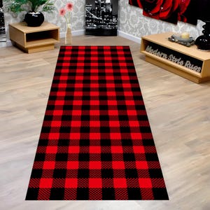 May include: A rectangular rug with a bold red and black buffalo plaid pattern. The rug is a long runner style, suitable for hallways or entryways. The design features large, evenly spaced squares.