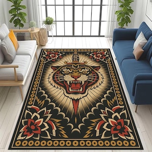 May include: Rectangular rug featuring a tiger head design with a dagger through its forehead. The rug has a black background with a border of repeating circles. Red and gold floral accents surround the tiger head, with a sunburst design behind it.