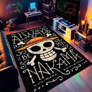May include: Black rectangular rug featuring a white skull and crossbones design with a straw hat, and the text "YOU WILL ALWAYS BE MY NAKAMA". The rug is a gaming room accessory.