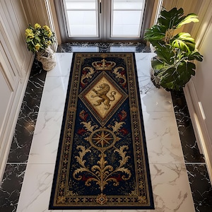 May include: A rectangular navy blue rug with a gold lion crest, crown, and compass rose design. The rug has a diamond pattern in the center and ornate gold floral accents. The rug is placed on a white tile floor.