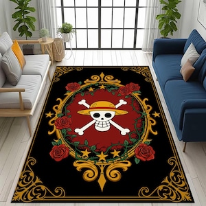 May include: Black rectangular area rug featuring a central design of a skull and crossbones wearing a straw hat, surrounded by roses and a gold frame. The rug has a black border with gold scrollwork and is placed in a living room setting.