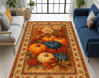Puede incluir: Alfombra rectangular con temática de cosecha otoñal. La alfombra presenta calabazas en tonos naranja, azul y crema, rodeadas de hojas y flores de otoño. Un borde decorativo enmarca el diseño central. Ideal para el salón.