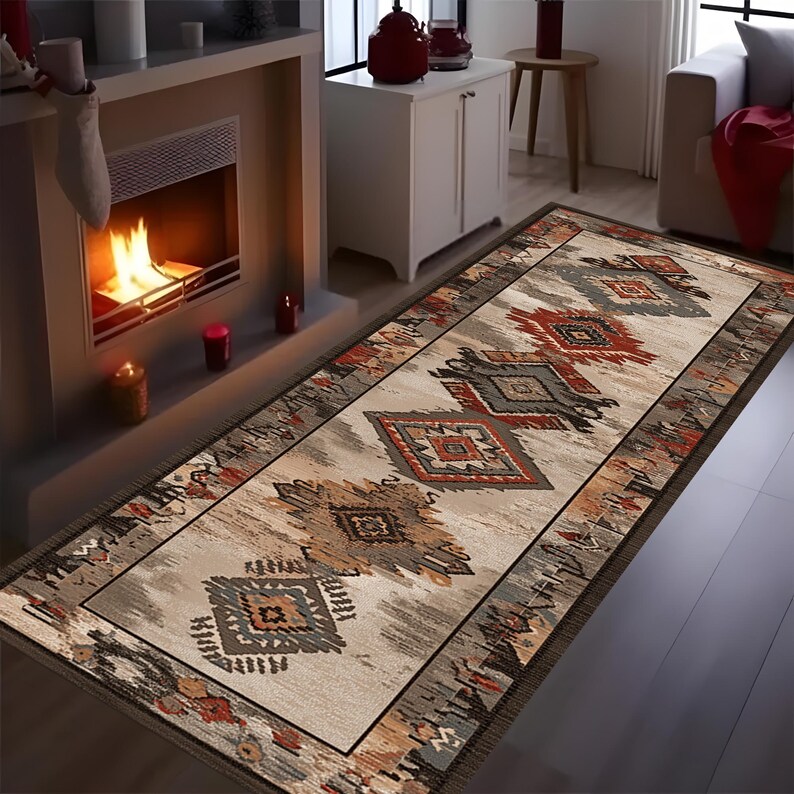 May include: A rectangular area rug with an intricate geometric pattern in shades of beige, gray, red, and brown. The rug features a central design of diamond and tribal motifs, bordered by a darker brown edge. The rug is placed in front of a fireplace.