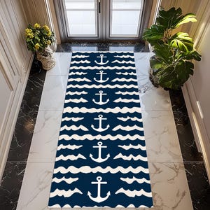 May include: A navy blue nautical-themed runner rug with a repeating pattern of white anchors and wavy lines. The rug is rectangular and placed in a hallway, adding a decorative touch to the entryway.