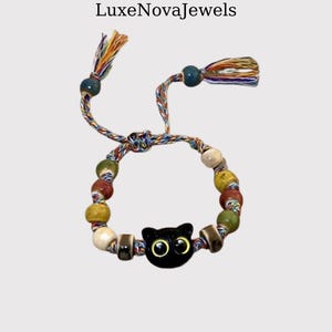 Black Cat Beaded Bracelet: Boho Woven Cord Jewelry with Tassels