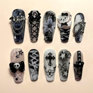 May include: A set of three ceramic mugs with a speckled, matte finish. The mugs are in shades of cream, light gray, and dark gray. Each mug has a simple, minimalist design, perfect for coffee or tea.