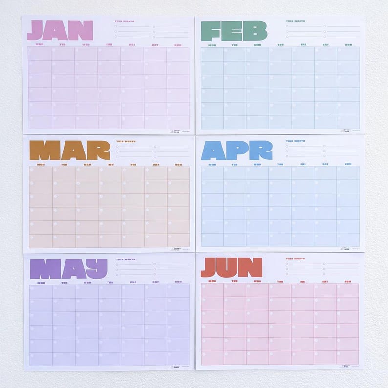 May include: Six colorful monthly calendars, each with a different pastel background color. The months are printed in bold, uppercase letters: JAN, FEB, MAR, APR, MAY, and JUN. Each calendar has a grid for daily entries.