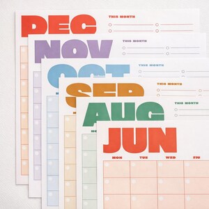 May include: A stack of colorful monthly calendar pages. Each page features a month's name in bold, large letters: DEC, NOV, OCT, SEP, AUG, and JUN. The calendars have a simple layout with space for notes and dates.