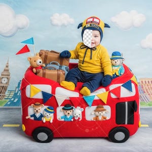 May include: A child in a yellow outfit and London bus hat sits in a red toy bus decorated with flags and teddy bears. The background features a painted cityscape with Big Ben and other landmarks, creating a playful travel theme.