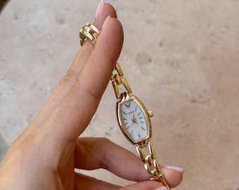 Reloj de pulsera dorado para mujer, esfera ovalada de 22 mm, diseño minimalista, regalo para ella.