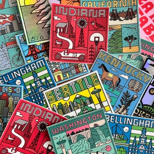 May include: A collection of colorful stickers featuring illustrations of various cities and states, including Indiana, California, Kentucky, Seattle, Washington, and Bellingham. Each sticker has a unique design and includes the name of the city or state.