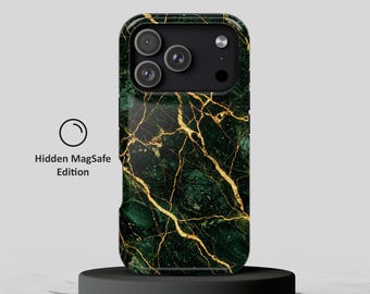 May include: A smartphone case featuring a dark green marble pattern with gold veining. The case has a black camera module cutout and includes the text Hidden MagSafe Edition printed to the left of the device.
