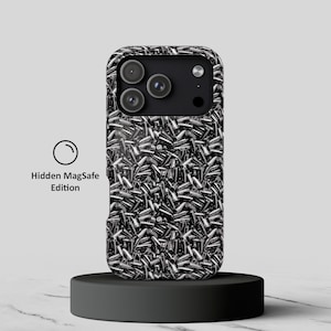 May include: A black and white smartphone case featuring a repeating pattern of metallic bullet casings across the entire back surface. The case includes a black camera module cutout and the text Hidden MagSafe Edition printed to the left side.
