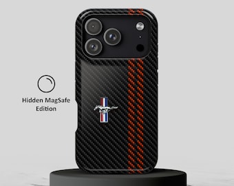 May include: A black carbon fiber patterned phone case featuring a vertical red stripe and a centered silver Mustang horse emblem. The case has a triple camera cutout and includes the text Hidden MagSafe Edition with a circular icon.