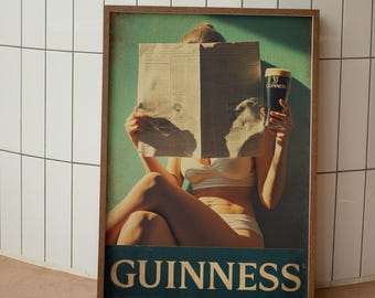 May include: A framed print depicting a person reading a newspaper and holding a pint of Guinness. The print has a teal background with the word "GUINNESS" at the bottom. The frame is brown.