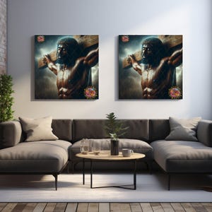 May include: Two framed wall art pieces showing a muscular figure bearing a wooden cross, set against a stormy sky. The artwork uses a dark colour palette with detailed shading. The pieces are displayed above a grey sofa in a modern living room setting.