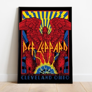 May include: Def Leppard concert poster in a black frame. The artwork features a red angel with outstretched wings, the band's name, and the date and location of the concert: July 14th, 2022, FirstEnergy Stadium, Cleveland Ohio.