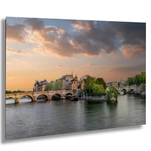 Île De La Cité Sunrise View From Pont Des Arts In Paris France With Pink Sky Clouds Over Seine River And Historic City Architecture