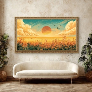 Könnte beinhalten: Ein rechteckiges Landschaftsgemälde in einem goldenen Rahmen zeigt ein goldenes Weizenfeld unter einer leuchtend orangefarbenen Sonne und einem blaugrünen Himmel mit flauschigen Wolken. Mehrere Vögel fliegen in der Ferne über dem Feld.