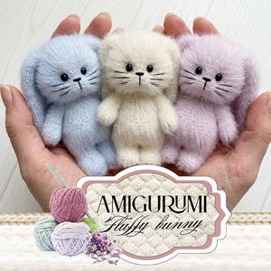 May include: Three fluffy amigurumi bunnies in pastel colors: light blue, cream, and lavender. Each bunny has black eyes and whiskers. The image includes yarn and the text "AMIGURUMI Fluffy bunny".