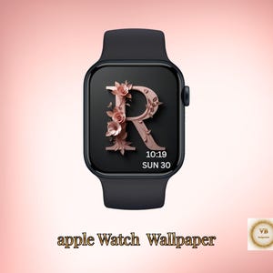 May include: Black Apple Watch with a custom wallpaper featuring a rose gold letter "R" adorned with floral accents. The watch face displays the time as 10:19 and the date as Sun 30. The words "apple Watch Wallpaper" are at the bottom.