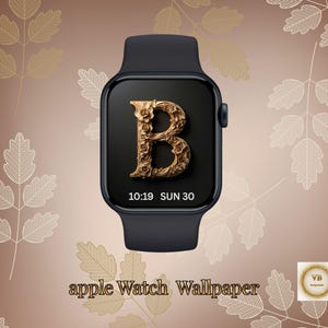 May include: Black Apple Watch with a custom wallpaper featuring a gold floral letter "B". The watch face displays the time and date. The background is a gradient of brown and gold with leaf designs.