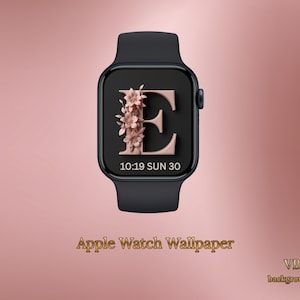 May include: Black Apple Watch with a custom wallpaper showing the letter "E" in rose gold, decorated with flowers. The watch face displays the time as 10:19 and the date as SUN 30. The words "Apple Watch Wallpaper" are at the bottom.
