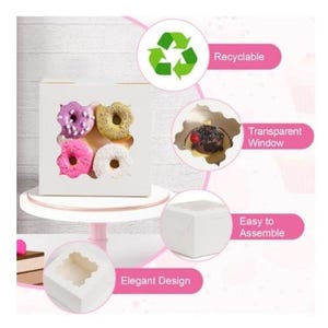 May include: A white bakery box with four clear windows, showcasing colorful donuts. The donuts are frosted in pink, purple, yellow, and white. The box is on a white cake stand. Text on the image says "Recyclable", "Transparent Window", "Easy to Assemble", and "Elegant Design".