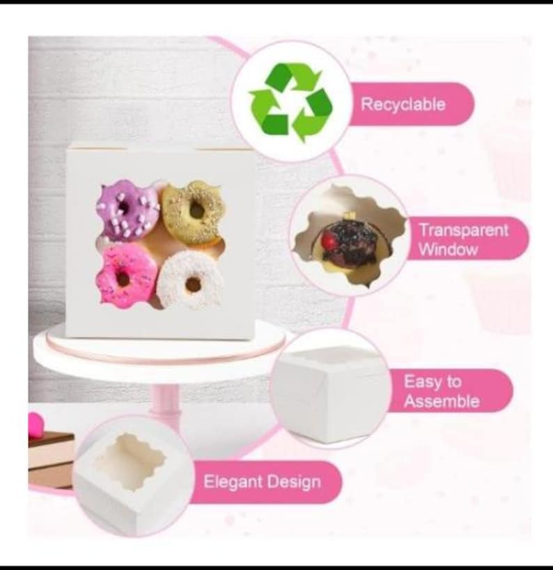 May include: A white bakery box with four clear windows, showcasing colorful donuts. The donuts are frosted in pink, purple, yellow, and white. The box is on a white cake stand. Text on the image says "Recyclable", "Transparent Window", "Easy to Assemble", and "Elegant Design".