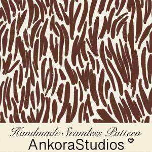 May include: A seamless pattern featuring dark brown, elongated, brushstroke-like shapes on a cream background. Below the pattern, a cream-colored banner displays the black text: Handmade Seamless Pattern AnkoraStudios with a small heart symbol.