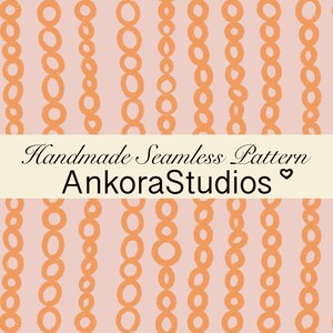 May include: A seamless pattern featuring vertical rows of hand-drawn orange circles on a light pink background. A central cream-coloured horizontal banner displays the black text Handmade Seamless Pattern AnkoraStudios with a small heart icon.