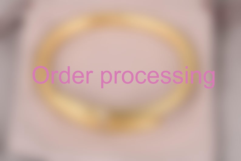 May include: A blurred image with the text "Order processing" in pink. The background has a soft, light pink hue with a golden-yellow oval shape in the center.