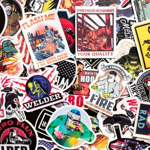 May include: A collection of colorful stickers featuring welding themes. The stickers display images of welders, sparks, and text like "Flash Me, I'm Welder" and "Your Focus Determines Your Quality". The stickers are in various shapes and sizes.