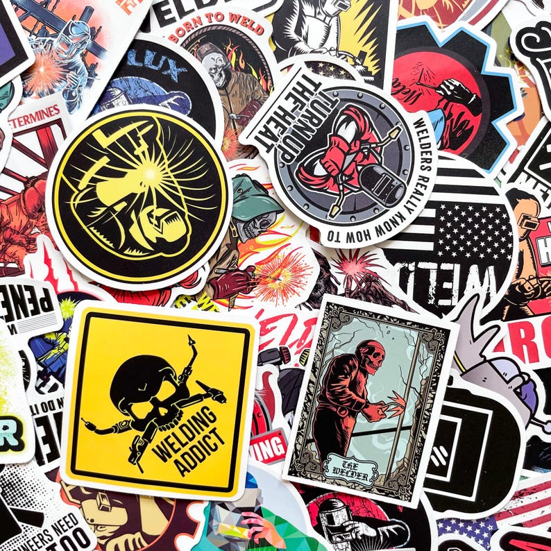 May include: A collection of colorful stickers with welding-themed designs. The stickers feature images of welders, welding tools, and text like "Welding Addict" and "Born to Weld". The stickers are in various shapes and sizes.