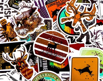 May include: A collection of outdoor-themed stickers featuring deer, hunting permits, and camping designs. The stickers showcase a variety of colors, including orange, brown, and green, with some featuring text like "Hunting Permit" and "Life is a Beautiful Adventure."